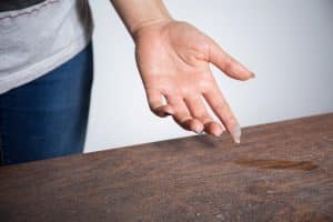 dust on woman finger